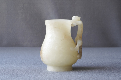 A Chinese celadon russet jade chilong-handled jug, Qing