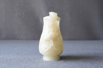 A Chinese celadon russet jade chilong-handled jug, Qing