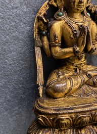 Une figure de Bouddha en bronze dor&eacute; incrust&eacute;, Sino-Tibet, Ming