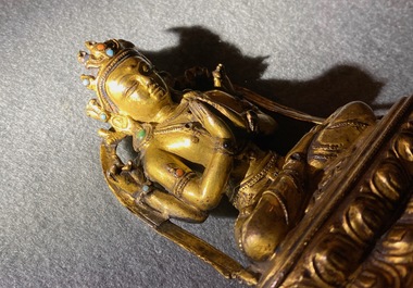 A Sino-Tibetan inlaid gilt bronze figure of Buddha, Ming