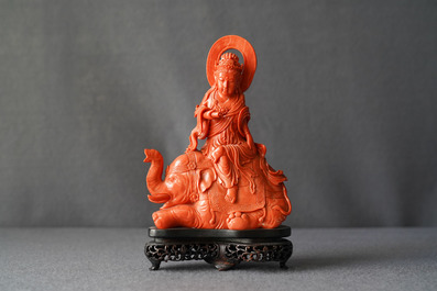 A Chinese carved red coral group of Guanyin on an elephant, 19th C.