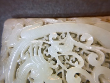 A Chinese reticulated pale celadon jade 'dragon and phoenix' carving, Ming