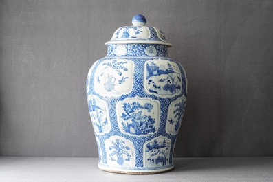 A Chinese blue and white covered vase with floral and landscape panels, Kangxi