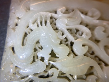 A Chinese reticulated pale celadon jade 'dragon and phoenix' carving, Ming