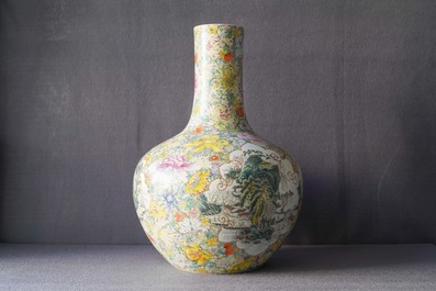A pair of Chinese famille rose millefleurs bottle vases, Qianlong mark, 19/20th C.