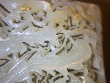 A Chinese reticulated pale celadon jade 'dragon and phoenix' carving, Ming