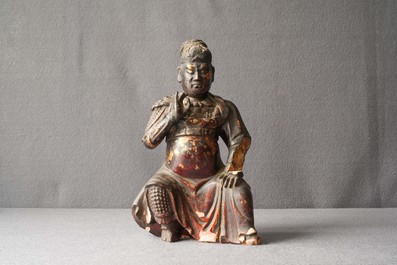 A Chinese gilt-lacquered wood figure of Guan Yu, Ming