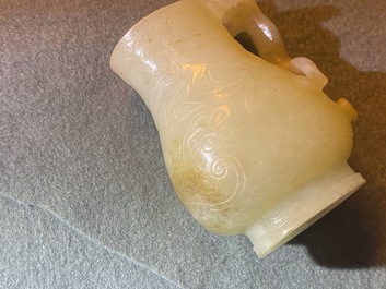 A Chinese celadon russet jade chilong-handled jug, Qing