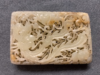 A Chinese reticulated pale celadon jade 'dragon and phoenix' carving, Ming