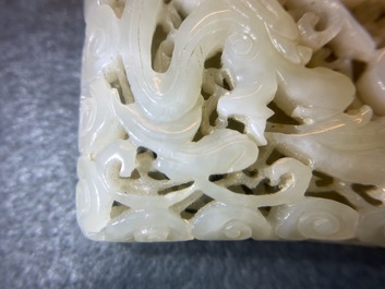 A Chinese reticulated pale celadon jade 'dragon and phoenix' carving, Ming