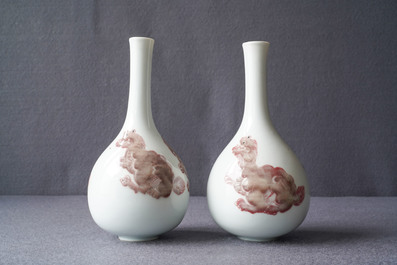 A pair of Chinese copper red 'mythical beasts' vases, Kangxi