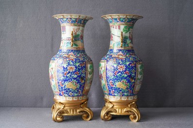 A pair of Chinese Canton famille rose vases with gilt bronze mounts, 19th C.