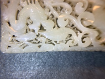 A Chinese reticulated pale celadon jade 'dragon and phoenix' carving, Ming