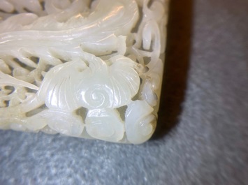 A Chinese reticulated pale celadon jade 'dragon and phoenix' carving, Ming