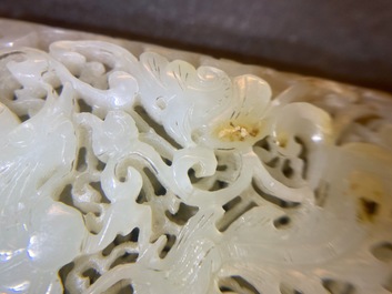 A Chinese reticulated pale celadon jade 'dragon and phoenix' carving, Ming