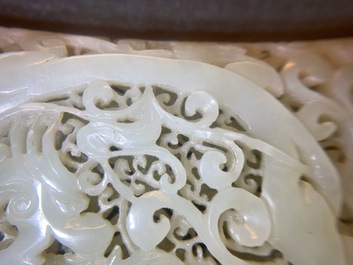 A Chinese reticulated pale celadon jade 'dragon and phoenix' carving, Ming