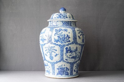 A Chinese blue and white covered vase with floral and landscape panels, Kangxi