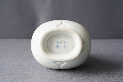 Un vase de forme hu en porcelaine blanc de Chine translucide, marque et &eacute;poque de Yongzheng