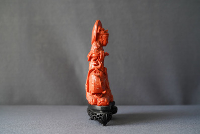 A Chinese carved red coral group of Guanyin on an elephant, 19th C.