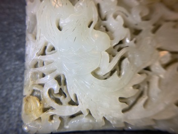 A Chinese reticulated pale celadon jade 'dragon and phoenix' carving, Ming