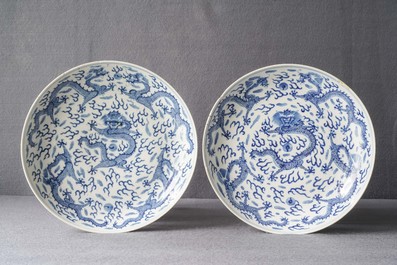 A pair of Chinese blue and white 'dragon' dishes, Kangxi mark, Guangxu