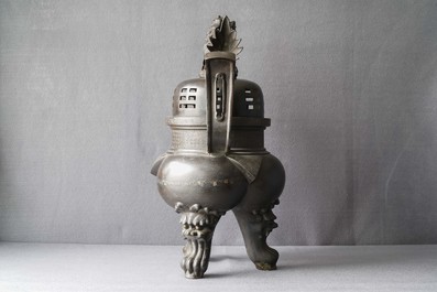 A large Chinese bronze incense burner and cover on carved wooden stand, Ming