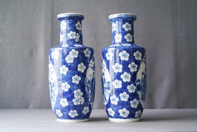 A pair of Chinese blue and white rouleau vases with figures near an elephant, Kangxi mark, 19th C.