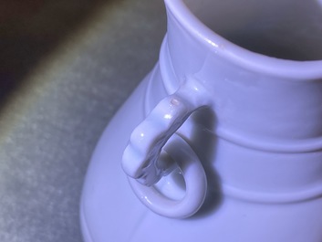 Un vase de forme hu en porcelaine blanc de Chine translucide, marque et &eacute;poque de Yongzheng