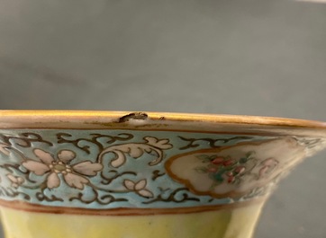 A pair of Chinese yellow-ground famille rose relief-decorated vases, 19th C.