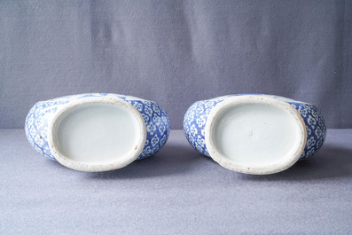 A pair of Chinese blue and white 'moonflask' vases and a covered jar, 19th C.