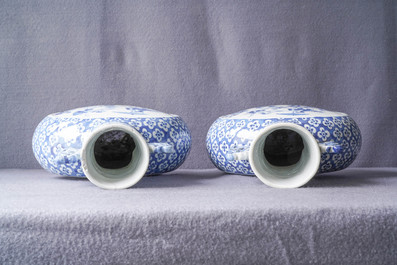 A pair of Chinese blue and white 'moonflask' vases and a covered jar, 19th C.