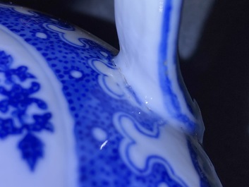 A Chinese blue and white two-handled 'lotus scroll' jug, Qianlong mark, 19/20th C.