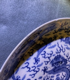 A pair of Chinese blue and white 'dragon' dishes, Kangxi mark, Guangxu