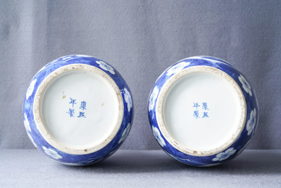 A pair of Chinese blue and white rouleau vases with figures near an elephant, Kangxi mark, 19th C.