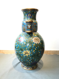 A large Chinese cloisonn&eacute; hu vase with lotus scrolls, marked Qi Yu Bao Tung Chih Chen, 19th C.