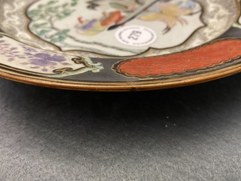 A Chinese famille rose plate with a lady playing a qin, Yongzheng