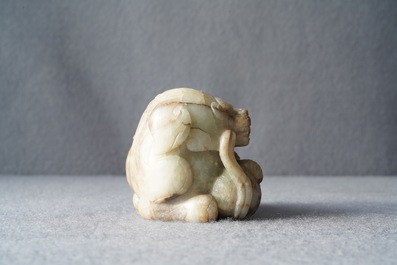 A Chinese pale grey-brown jade model of a Buddhist lion, 19/20th C.