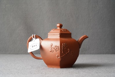 A Chinese Yixing stoneware teapot and cover with applied prunus design, Kangxi