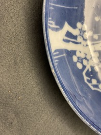 A rare Chinese reverse-decorated 'magpie and prunus' plate, Transitional period