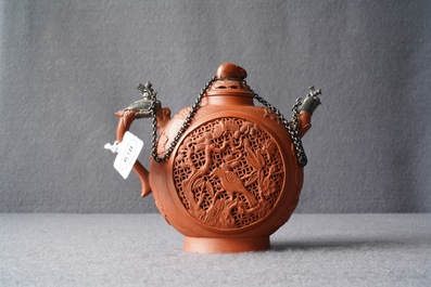 Een Chinese dubbelwandige opengewerkte Yixing steengoed theepot met zilveren montuur, Kangxi