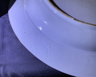 A pair of Chinese famille verte dishes and a caf&eacute;-au-lait-ground plate, Kangxi