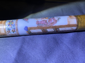 A Chinese famille rose opium pipe with silk pouch, 19th C.