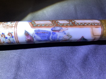 A Chinese famille rose opium pipe with silk pouch, 19th C.