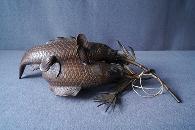 A Japanese bronze group depicting two koi fish, Meiji, 19th C.