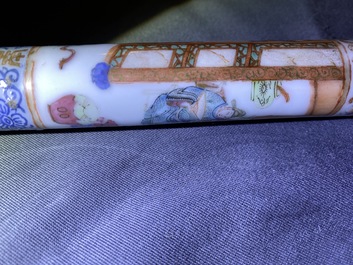 A Chinese famille rose opium pipe with silk pouch, 19th C.