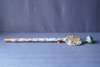 A Chinese famille rose opium pipe with silk pouch, 19th C.