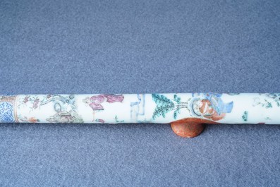 A Chinese famille rose opium pipe with silk pouch, 19th C.