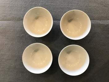 Four Chinese famille rose 'mandarin' cups and saucers, Qianlong