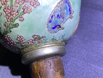 A Chinese famille rose opium pipe with silk pouch, 19th C.