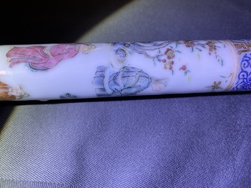 A Chinese famille rose opium pipe with silk pouch, 19th C.